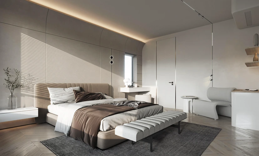 Calm master bedroom with a warm cove light tracing the curved ceiling and a slim magnetic track above an upholstered bed